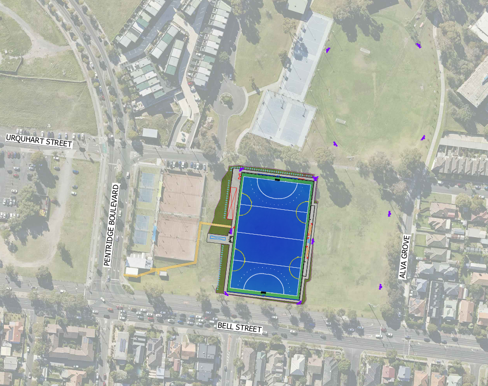 An aerial photo of McDonald Reserve. There is a blue hockey pitch drawn over the left side of the open space. There are other markings indicating additions being made as part of the works.
