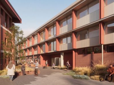 A computer generated impression of a large rectangular building around 3 storeys high. The building is peach coloured tiles and concrete with a metallic finish on the top storey..